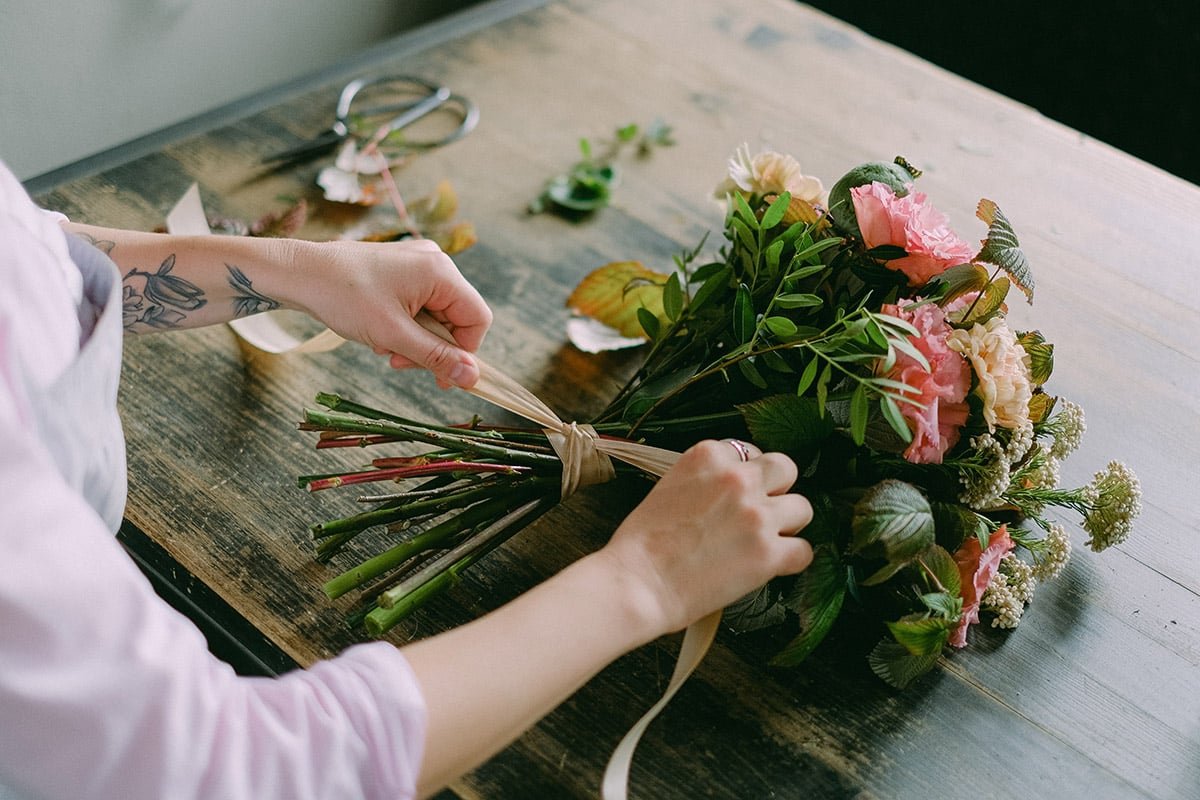 making a bouquet with cut flowers