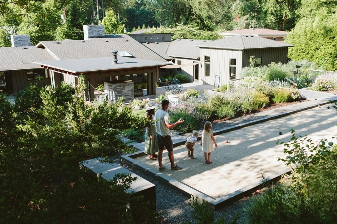 Bocce Ball Court with Family - 7 Dees Landscaping Bocce ball court with a family playing in their shady backyard - 7 Dees Landscaping