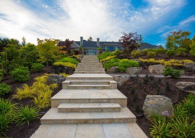 landscaped stone steps leading to luxury home by Dennis' 7 Dees