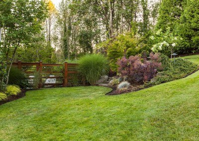 wood screen with plantings in landscape
