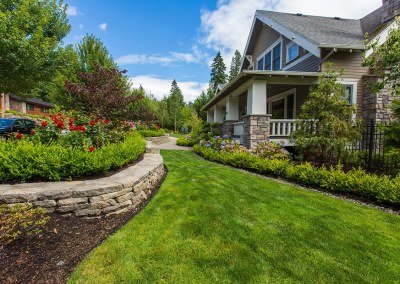 Residential Landscape Design with Stone Wall, Lawn, and Plants by Dennis' 7 Dees