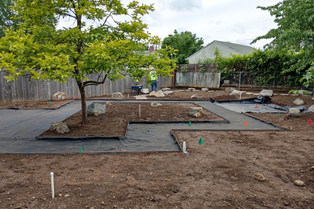 Gravel Xeriscaped Landscape in Progress - 7 Dees Landscaping Landscape in progress with angled path and dirt with boulders - 7 Dees Landscaping