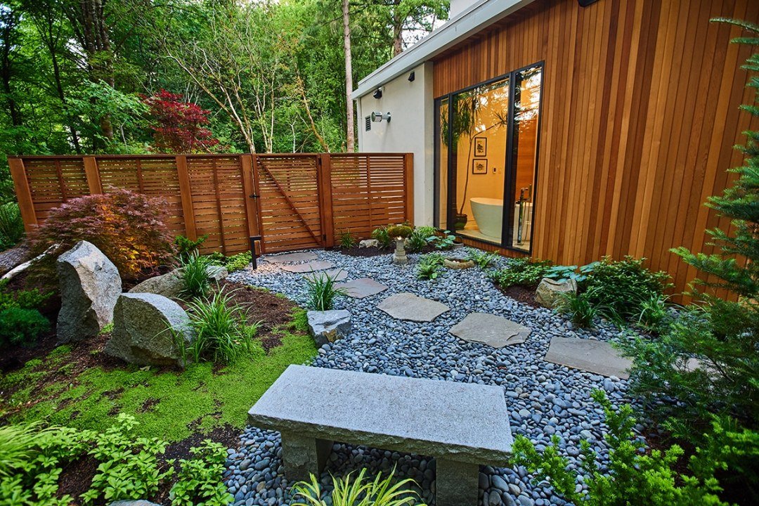 bench and stone pathway with shade plants and wood fence bench and stone pathway with shade plants and wood fence