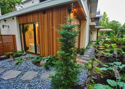 Natural stone path and shade plantings by Dennis' 7 Dees Landscaoing