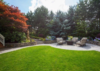 tranquil patio and garden landscape with green lawn fall color