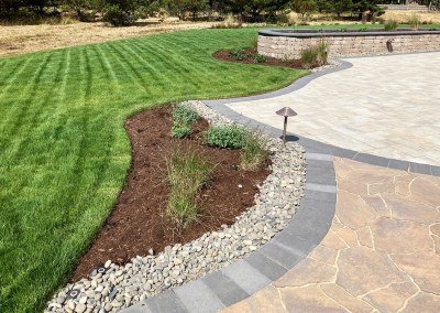 organic hardscaped patio and lawn by Dennis' 7 Dees