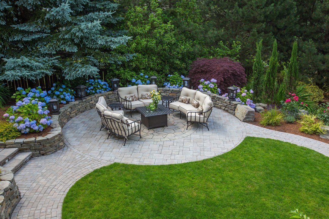 Round patio with firepit and retaining wall Jasmine vine growing vertically on a trellis - by Dennis' 7 Dees Round patio with firepit and retaining wall Jasmine vine growing vertically on a trellis - by Dennis' 7 Dees