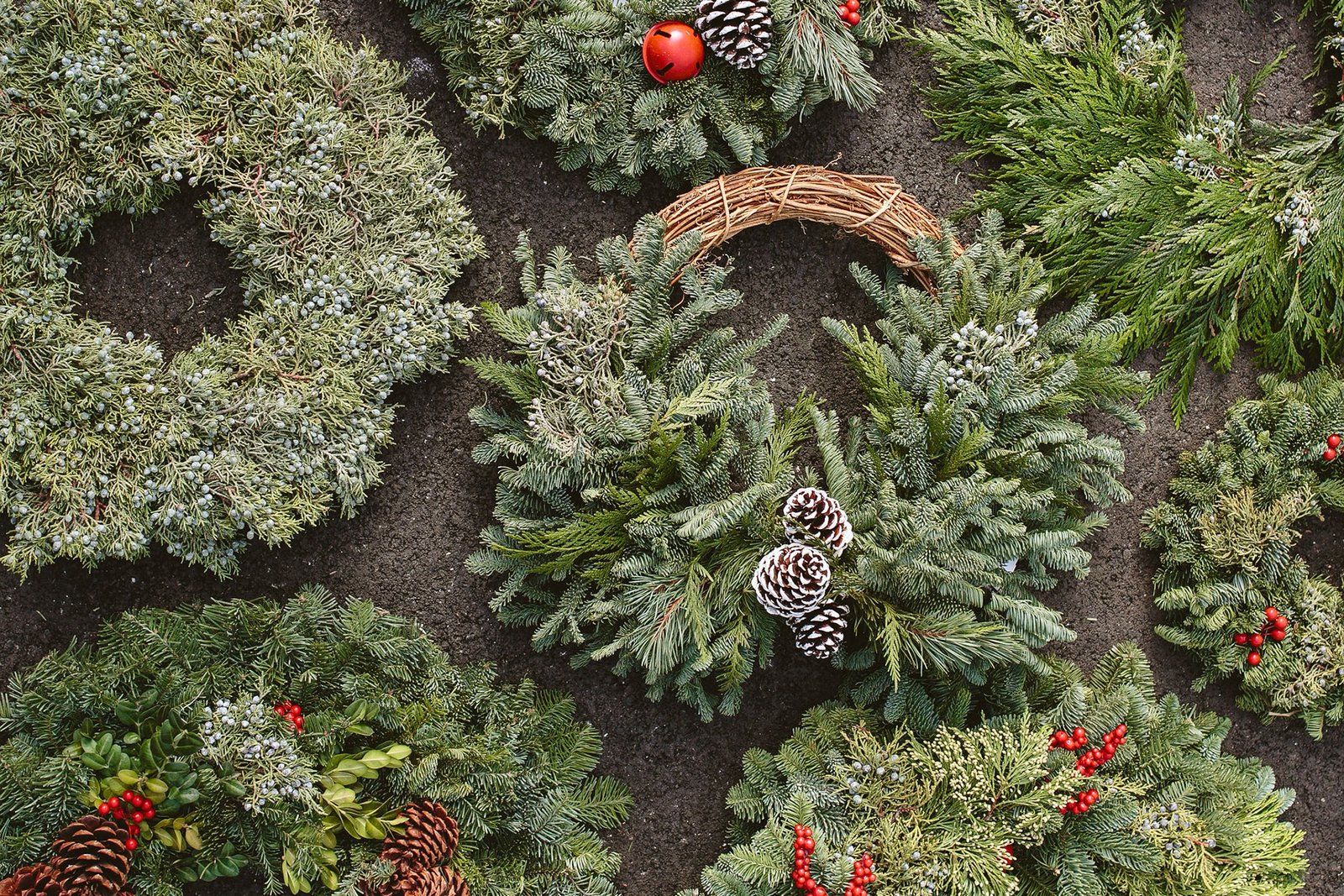 various festive holiday wreaths with fresh greens at Dennis' 7 Dees Garden Center